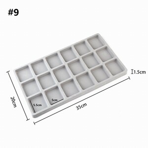 May include: Gray rectangular tray with 20 square compartments. The tray measures 11.5 inches long, 5.5 inches wide, and 1.5 inches high.