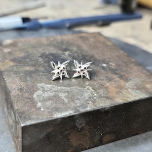 Pair of Arlecchino Fatui flower silver stud earrings