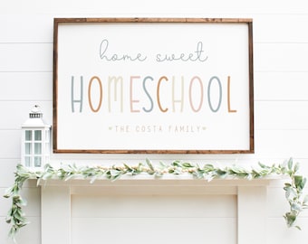 May include: A wooden sign with the text "home sweet HOMESCHOOL" in colorful letters. The sign also includes the text "THE COSTA FAMILY" in smaller letters below the main text.