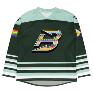 May include: Dark green hockey jersey with a light teal yoke and sleeves. The jersey features a large, colorful "B" logo and rainbow and pride flag accents. The sleeves have white and teal stripes.