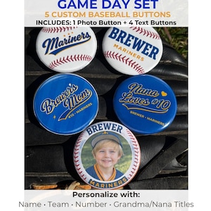 May include: A set of five custom baseball buttons. The buttons include one photo button and four text buttons. The buttons feature the text "Mariners", "Brewer", "Brewer's Mom", and "Nana Loves #10". The photo button has a picture of a child.