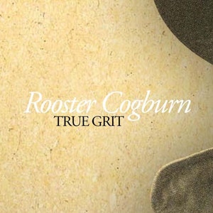 May include: A vintage-style poster with the text "Rooster Cogburn" in a flowing white font above "TRUE GRIT" in a black, bold font. The background is a textured, light tan color with a partial image of a hat.