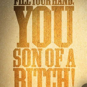 May include: A vintage-style poster with the text "FILL YOUR HAND, YOU SON OF A BITCH!" in bold, textured, gold lettering. The words are arranged in a stacked format against a tan background, with quotation marks at the top and bottom.