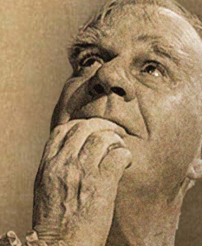 May include: Sepia-toned portrait of an older person, looking upwards with a contemplative expression. The person's hand is raised to their face, with fingers touching their mouth. The image is a close-up, focusing on the face and hand.