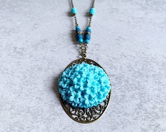 Blue Hydrangea Beaded Necklace - Antique Bronze Filigree Oval Pendant, Resin Flower Cabochon, Matte Navy Blue Beads, Turquoise Beads, Boho
