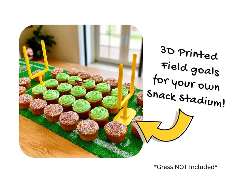 May include: Cupcakes arranged on a green surface to resemble a football field, with green frosting and sprinkles. Yellow 3D-printed field goal posts are placed on the field. Text reads: "3D Printed Field goals for your own Snack Stadium!" The grass is not included.