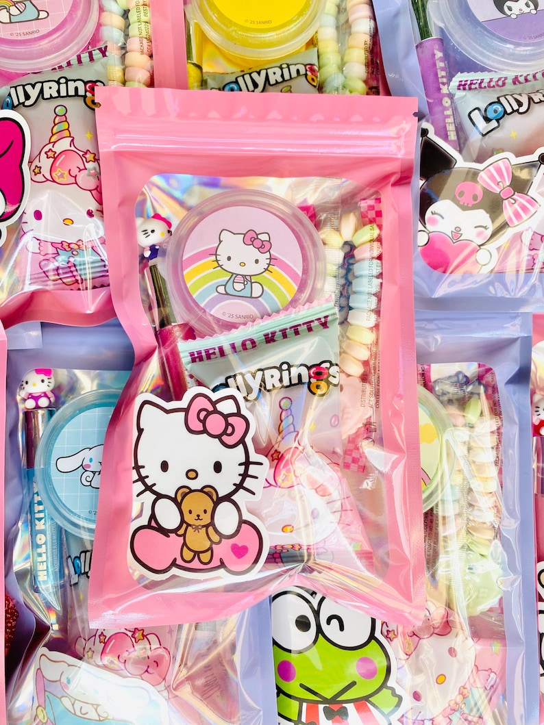 May include: Pink cellophane bags filled with colorful candies and Hello Kitty-themed stickers and accessories. The bags contain various candies, including rainbow-colored hard candies and lollipops. The image features multiple bags, creating a visually appealing display.