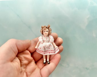 Dollhouse Miniature ~ Curly Shirley Blonde Hair Popular Little Girl from 1930s Small Porcelain Doll in White Dress with Red Polka Dots