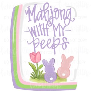 May include: A whimsical illustration with the text "Mahjong WITH MY peeps." The design features a pink tulip, two bunny figures, and a patch of green grass. The background has a pastel color scheme of green, pink, and purple.
