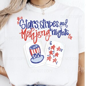 May include: White t-shirt with the text "Stars, Stripes and Mahjong Nights" in blue and red script. The shirt features illustrations of a patriotic Uncle Sam hat and Mahjong tiles with red stars.