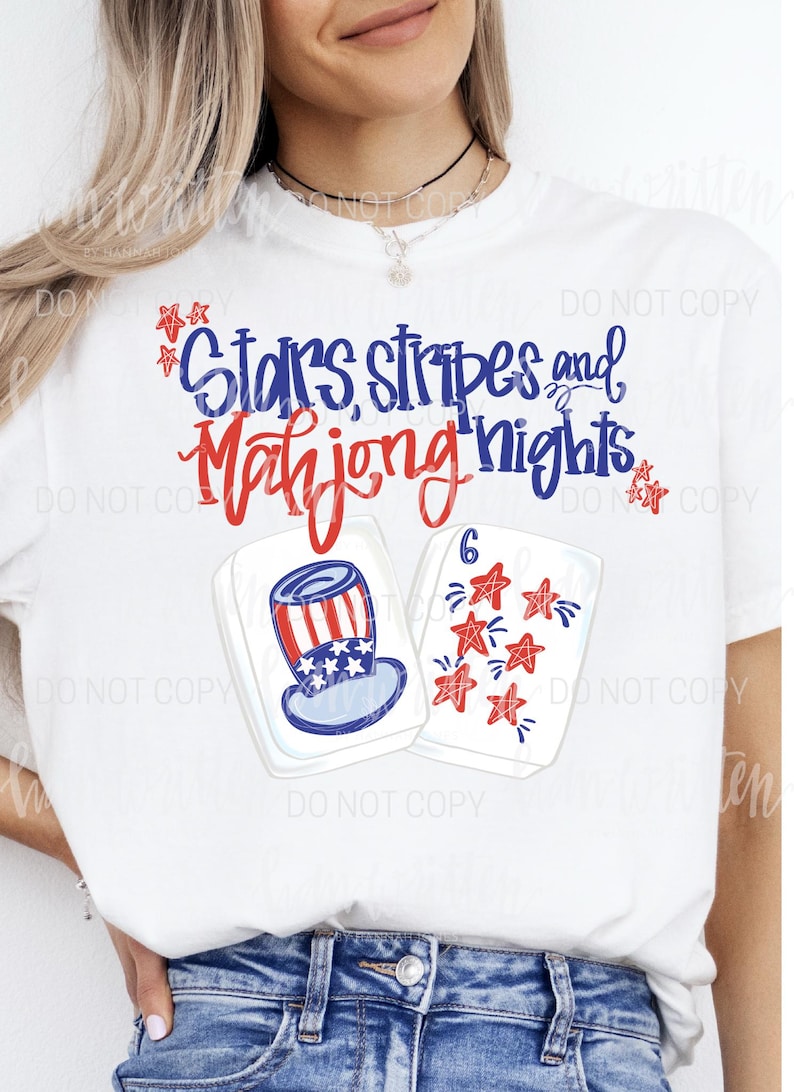 May include: White t-shirt with the text "Stars, Stripes and Mahjong Nights" in blue and red script. The shirt features illustrations of a patriotic Uncle Sam hat and Mahjong tiles with red stars.
