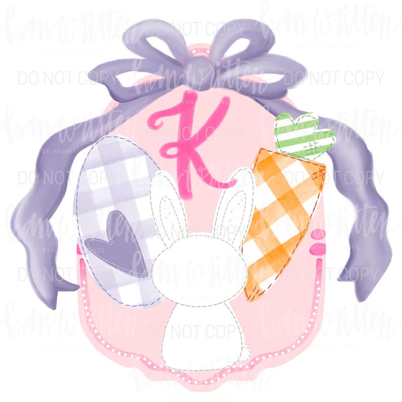 May include: A pink and purple Easter-themed design featuring a bunny, a checkered egg, a carrot, and the letter K. The design is surrounded by a purple ribbon.