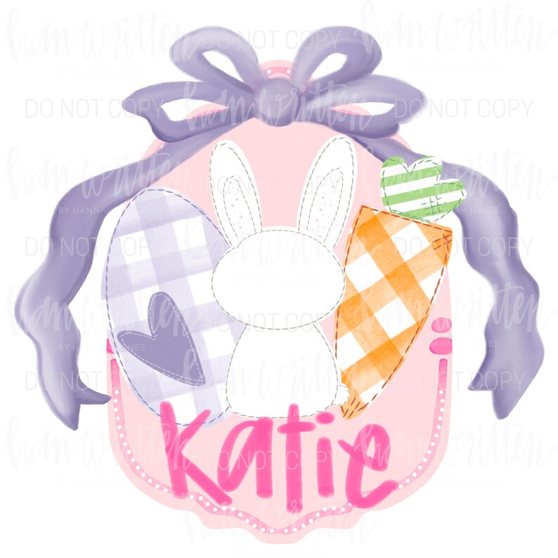 May include: A pink and purple Easter-themed personalized sign with a white bunny, a carrot, and a checkered egg. The sign says "Katie" in pink letters.