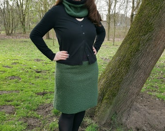 Women's skirt in green made of curly fleece with black cuffs. Available in every plus size.