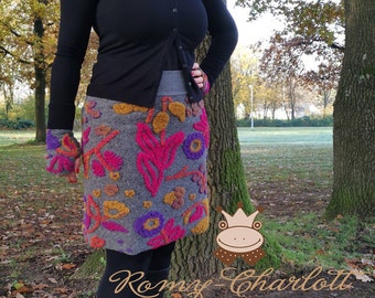 Women's skirt made of walkloden in gray with a pink, purple and yellow floral pattern. Cuff is gray. Available in every plus size.