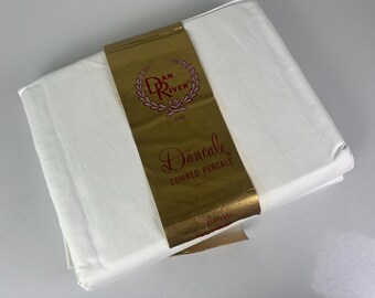 May include: A white sheet with a gold label that says "Dan River 1882" and "Dancale Combed Percale".