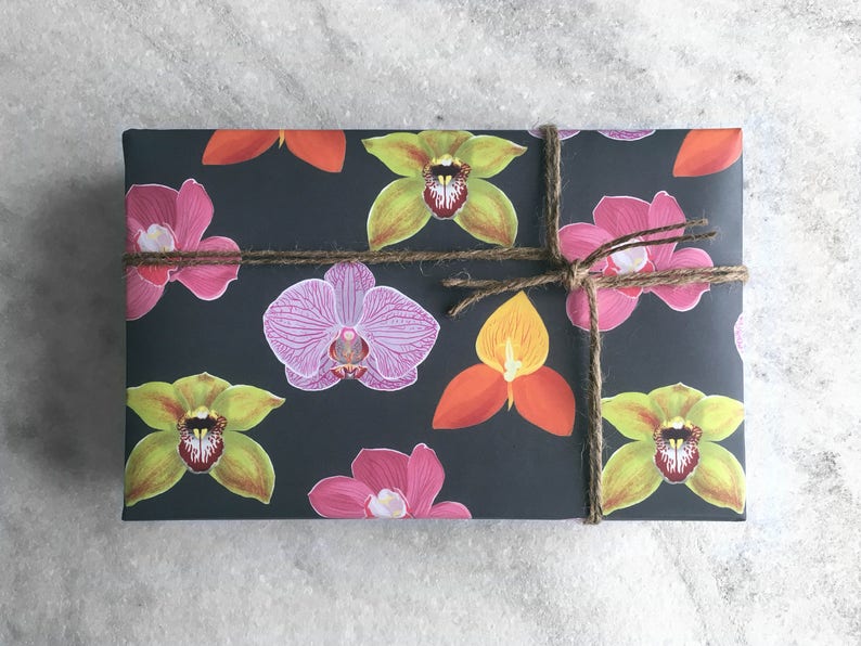 All occasion gift wrap, boldly colored orchid illustrations on a black background. Fine flat sheet wrapping paper.