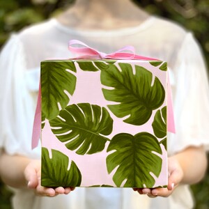 All occasion gift wrap, large green monstera leaves on a blush-pink background. Fine flat sheet wrapping paper.