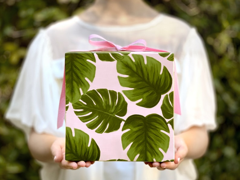 All occasion gift wrap, large green monstera leaves on a blush-pink background. Fine flat sheet wrapping paper.