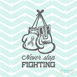 May include: A pair of gray boxing gloves hanging from a string with a gray ribbon inside one of the gloves. The text "Never stop FIGHTING" is below the gloves.