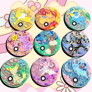 Full art phone grips , look at the inside a Pok ball from bio resin, eev, vapore, flare, jolt, esp, umbre, glace, leafe, sylve