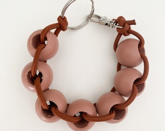Bracelet élastique perlé/porte-clés