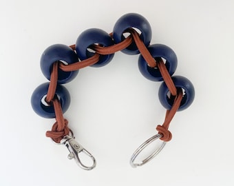 Bracelet élastique perlé/porte-clés