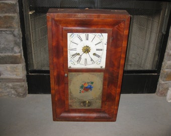 E.N. WELCH 30 HOUR Wall Clock 26" x 15" x 4" Pendulum Clock Heavy Weights Inside Metal Roman Numeral Face Forestville Conn. Does Not Work