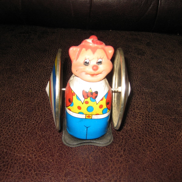 BEAR WHIRLING Wheel Windup Metal Toy Soft Head Plastic Bottom Key Wind MS 207 Measures 4 3/4" Tall 4" Wide Twirls While Wheels Spin (1970's)