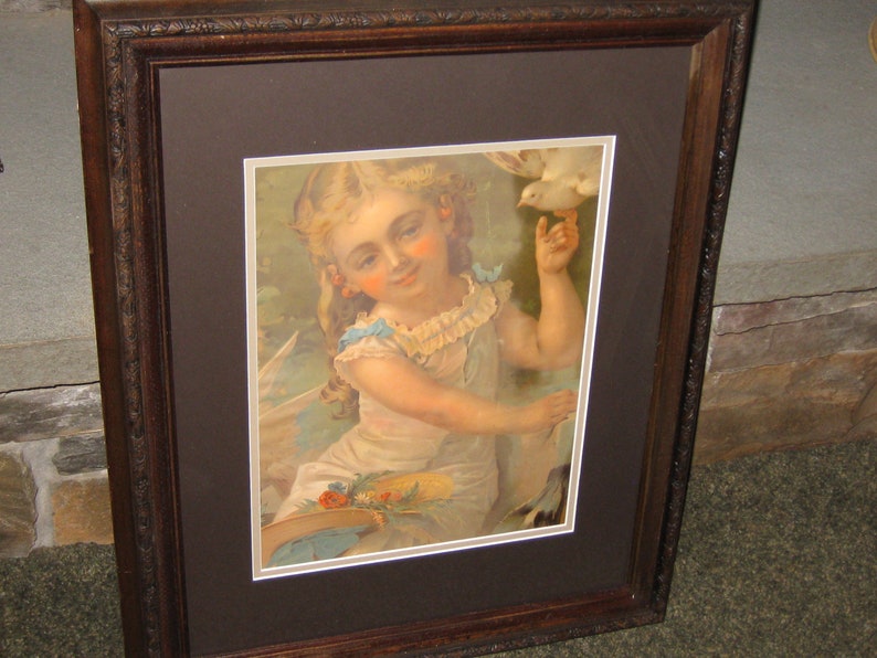 VICTORIAN CHROMOLITHOGRAPH Little Girl With Dove Wood Frame 19 12 x 23 34 Decorative Top Edge Matted In Brown Victorian Wall Art