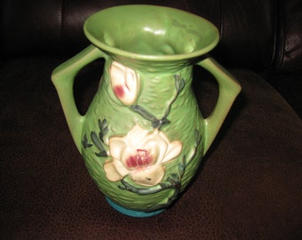 REPRODUCTION ROSEVILLE POTTERY Magnolia Vase 7 3/8" High 4 1/4" Across Top Green With Raised White Magnolias Front & Back Two Side Handles