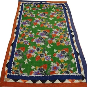 May include: A green kantha quilt with a floral pattern and a multi-colored border. The quilt is made of cotton and is hand-stitched.