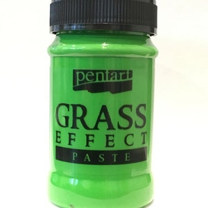 May include: A green jar of Pentart Grass Effect Paste. The jar has a black lid and a black label with white text.