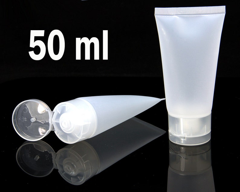 May include: Two clear plastic squeeze bottles with flip tops. One bottle is lying down with the top open. The other bottle is standing upright. Both bottles are labeled "50 ml".