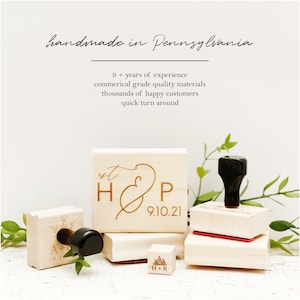 May include: A collection of wooden stamps with black handles and engraved designs. The stamps feature initials, dates, and a mountain graphic. Text on the image reads "handmade in Pennsylvania" and "9+ years of experience".
