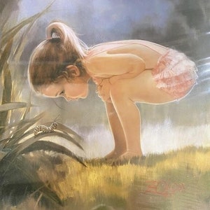 May include: A young child in a pink outfit, bent over, observing a caterpillar on a leaf. The artwork has a soft, painterly style with a focus on the child's curiosity and the natural world. The background features water and foliage.