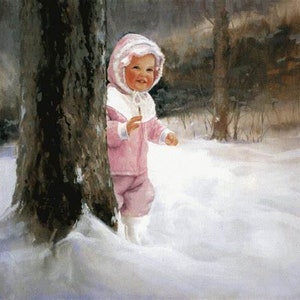 May include: A young child wearing a pink snowsuit with a white hood stands in the snow next to a tree trunk.