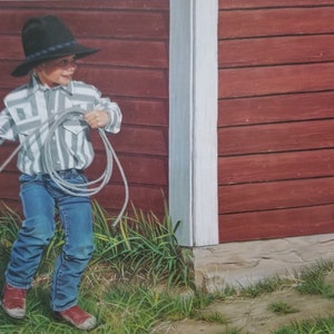 May include: A young person in a cowboy hat, striped shirt, and jeans twirls a rope, standing in front of a red barn. A black and white cat sits nearby, observing the scene. The image evokes a rural, playful atmosphere.