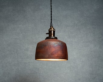 Angled Raku fired hanging pendant light in copper