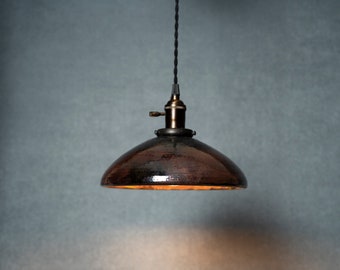 Round Raku fired hanging pendant light in metallic black and purple