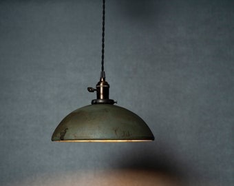 Round Raku fired hanging pendant light in dark green