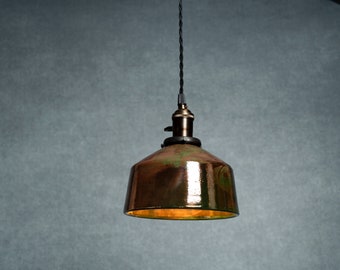 Angled Raku fired hanging pendant light in metallic copper and green