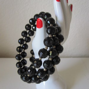 BLACK SPRING WIRE Faceted Black Bead Bracelet