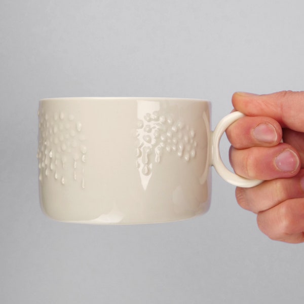 Handmade, wonky, medium sized porcelain cup with rainy cloud decoration, modern ceramic mug for tea, coffee, hot chocolate, gift idea