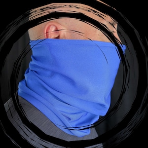 May include: A close-up of a person wearing a royal blue neck gaiter. The gaiter is made of a soft, stretchy fabric and is designed to be worn around the neck, face, or head.