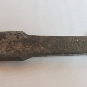 May include: A vintage wood chisel with a brass handle. The chisel is marked "Stanley No. 51/2".