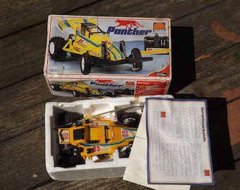 Auto da corsa vintage Nikko Panther RC Desert Racer completa di scatola originale e documenti