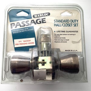 May include: A new Harloc Passage door knob set in its original packaging. The set is for hall and closet doors and includes solid brass knobs. The packaging states it fits old and new wood or metal doors and has a lifetime guarantee.