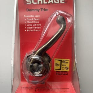 May include: A white ceramic mug with a black handle and the text "But First, Coffee" in a black, bold font. The mug is sitting on a white surface. The mug is approximately 4 inches tall.