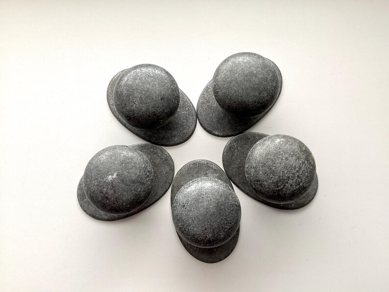 May include: A set of three ceramic mugs with a speckled, matte finish in cream, light grey, and dark grey. Each mug has a minimalist design, ideal for tea or coffee.